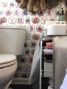 powder room, sink skirt, colorful wallpaper