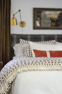 shibori bedding, brown curtains, brass light, vintage painting, Cate Holcombe Interiors