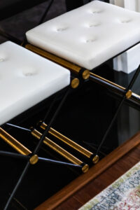 black and white stools with gold detail