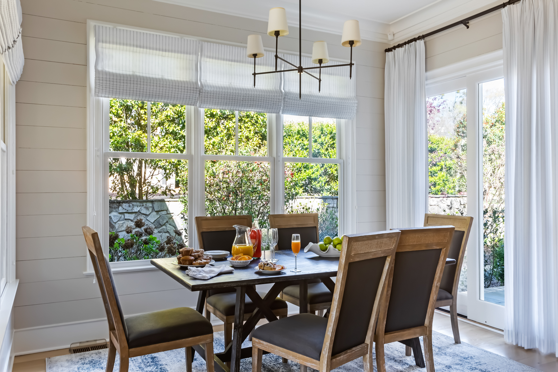 dining area featuring beautiful window treatments