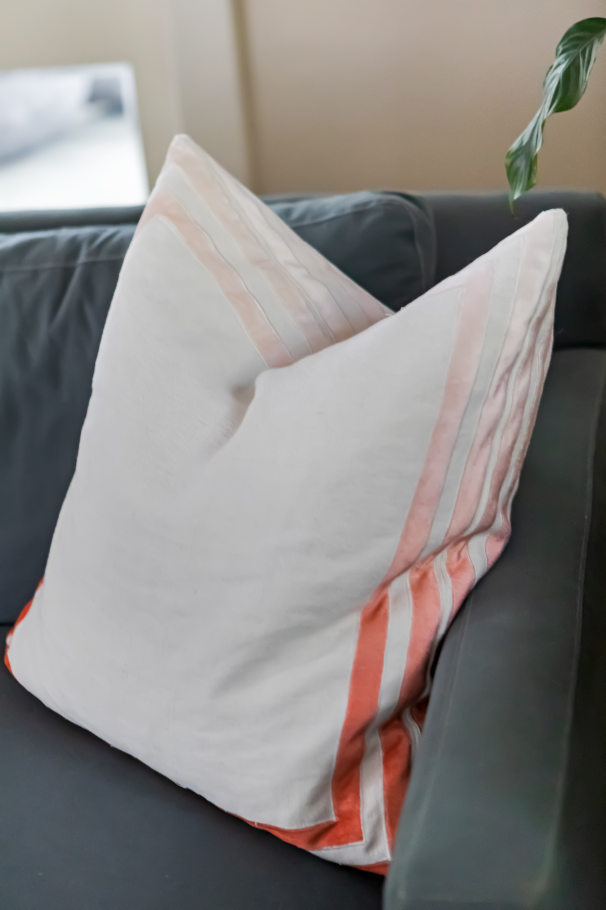 white pillow with coral ombre